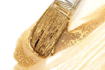 Painbrush and gold paint