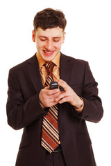 smiley businessman reading text message on his mobile