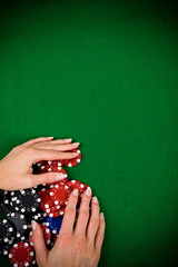 Female hand and poker chips