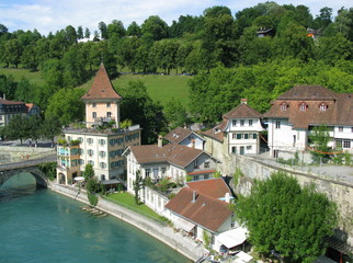 Fototapeta na wymiar Medieval houses by Aare river in Bern, capital of Switzerland.