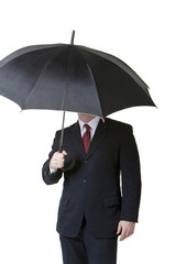 Businessman holding umbrella