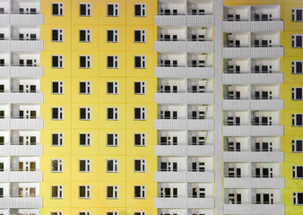 Fototapeta na wymiar Yellow building with white balconies