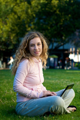 College Student studying outdoor with laptop