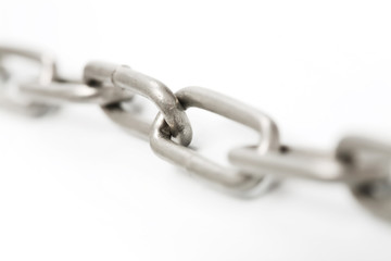 Macro shot of steel chain out of focus