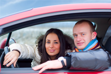 Fototapeta na wymiar happy couple in their car