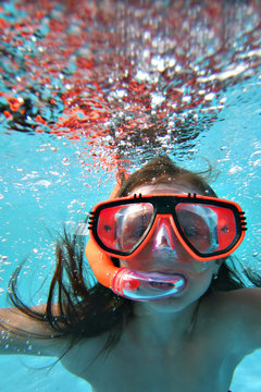 Girl swimming underwater