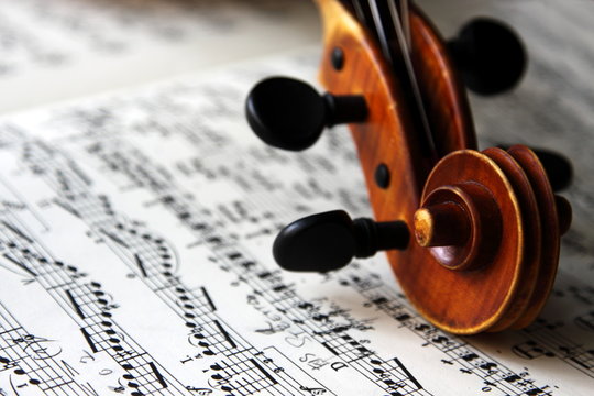 violin scroll and sheet music
