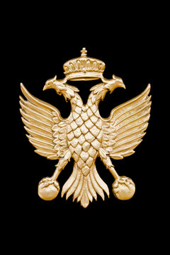 Golden two-headed eagle in black background.