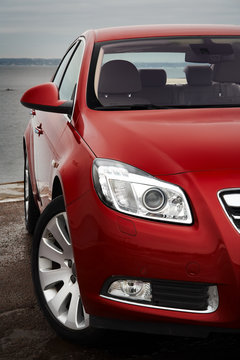 Fototapeta Cherry red car front detail