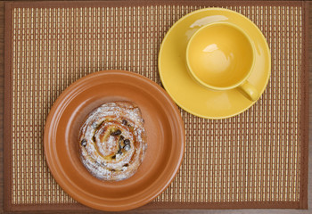 Sweet bun and  tea cup