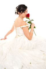 Fototapeta na wymiar Bride sniffing a red rose