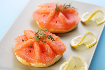 Smoked salmon on bagel with fresh black pepper.