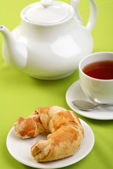 Breakfast concept with coffee and croissant