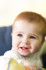 Portrait of joyful blue-eyes baby
