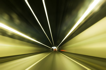 Cars moving fast in tunnel