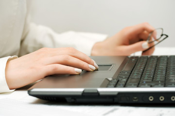 Female hands working at laptop.