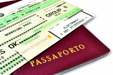Italian passport and air travel boarding pass.