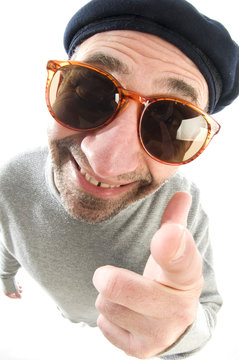 aging artist thinking distorted nose close up beret hat smiling