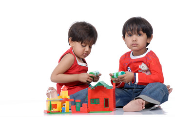 boy and girl playing with blocks