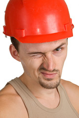 young worker in a red helmet