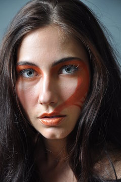a fashion model with painted face