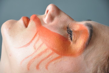 Naklejka premium a fashion model with painted face