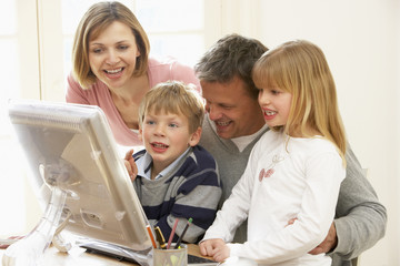 Fototapeta na wymiar Family Group Using Computer