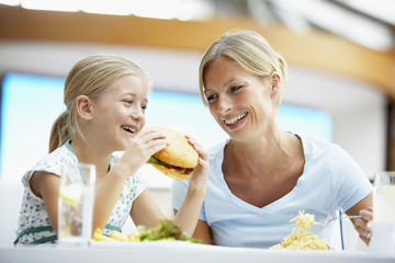 Mother And Daughter Having Lunch Together At The Mall