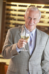 Man Having A Drink At A Bar