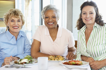 Friends Having Lunch Together At A Restaurant