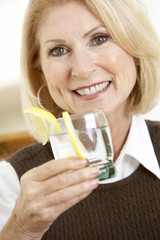 Woman Having A Drink At Home