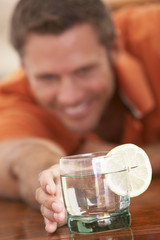 Man Having A Drink At Home