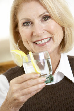 Woman Having A Drink At Home