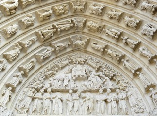 Obraz premium Carved stone lintel on a church door in France