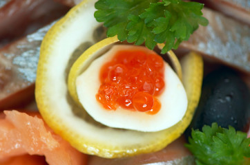 Plate with salted sea food and vegetables