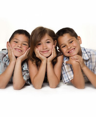Adorable group shot of two boys and on little girl