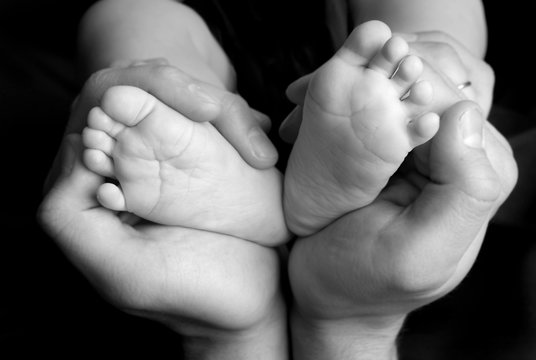 Baby's feet in daddy's hands 2