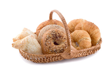Pastries in a basket isolated on a white background