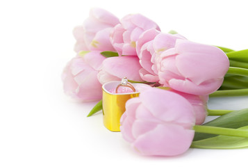 Ring and pink tulips isolated on white