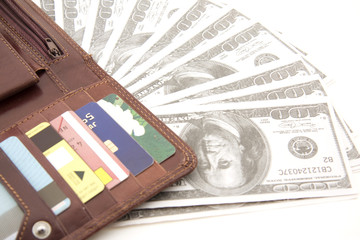 Wallet with credit card and 100 dollar bills