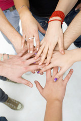 Fototapeta premium hands on top of each other; teamwork concept