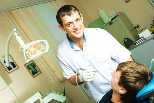 dentist curing the patient's teeth