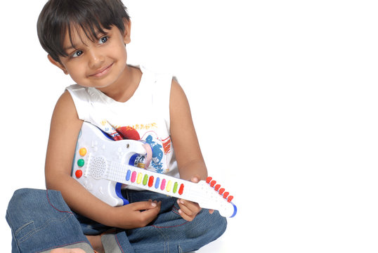 Boy With Toy Guitar