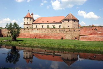 Fototapeta na wymiar Reflection of a medieval fortress from Transilvania Fagaras