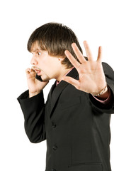 Upset businessman with cellular phone over white, no comments po