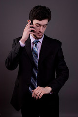 young businessman talking using mobile phone