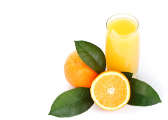 Fruits with green leaves and glass of juice