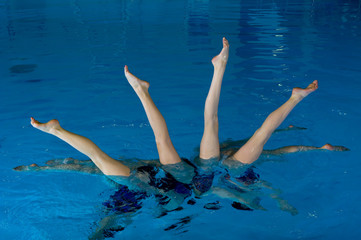 Synchronized swimmers with legs out of water