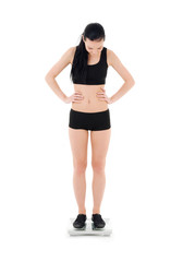 Fototapeta premium happy woman on scales