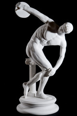 Classical white marble statue of naked discus thrower isolated